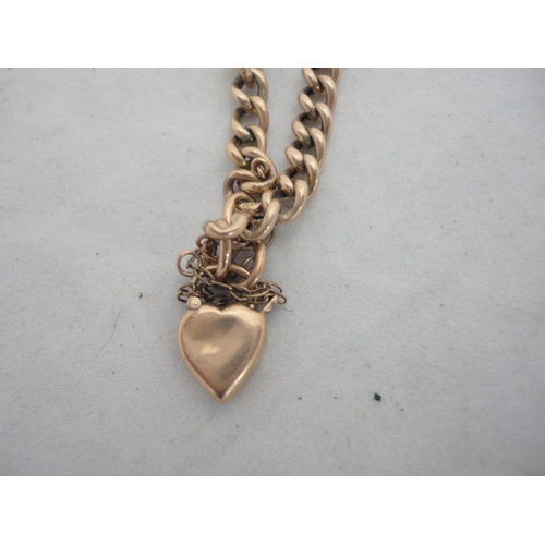 213 - 9ct gold bracelet with heart-shaped locket, 6.1g.
