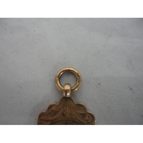 214 - 9ct gold medal fob, 6.6g.