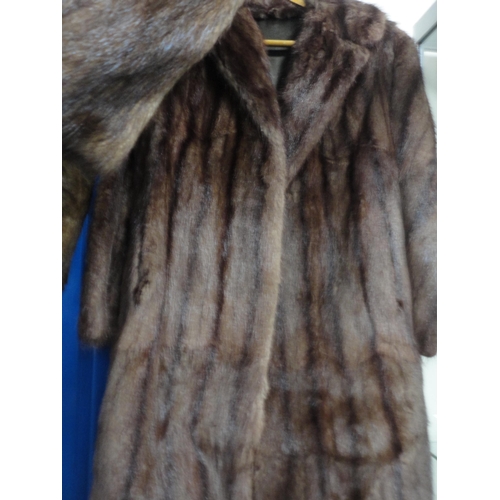 221 - Two simulated fur coats.