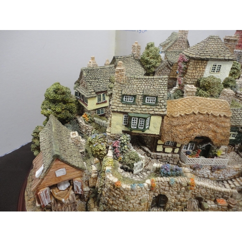225 - Lilliput Lane limited edition model village, 'Out of the Storm', on plinth stand, with box.