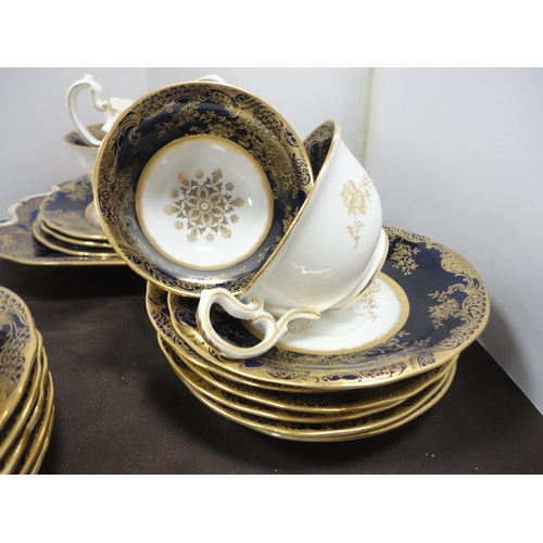 240 - Aynsley cobalt and gilt decorated part tea service.