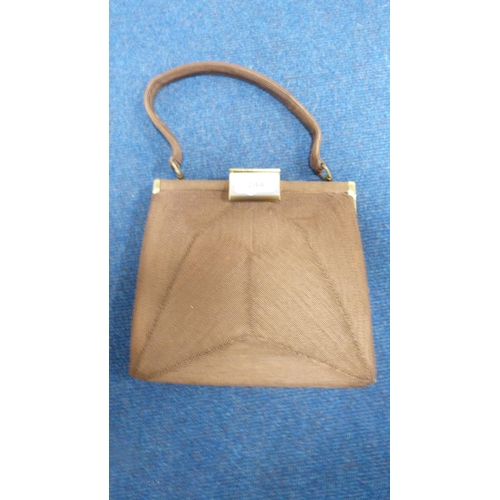 244 - Fur cape, two handbags, umbrella etc.