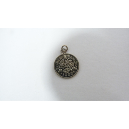 247 - Small leather case containing a silver threepence, earrings, kangaroo charm, pen knife, Japanese bur... 