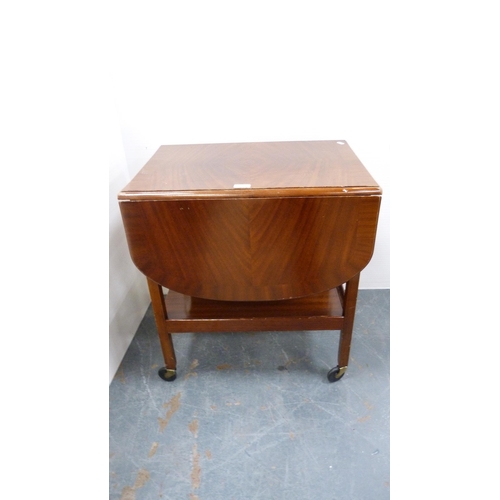 261 - Tea trolley and drum-shaped occasional table with tooled top.