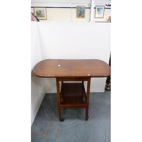 261 - Tea trolley and drum-shaped occasional table with tooled top.
