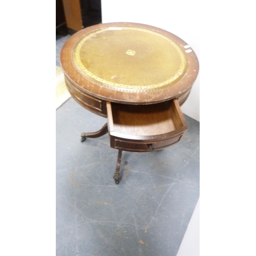 261 - Tea trolley and drum-shaped occasional table with tooled top.