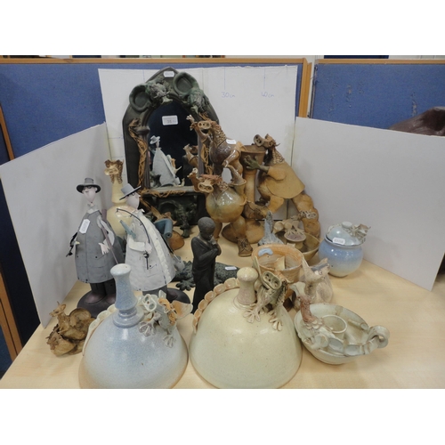 35 - Collection of contemporary figures and ornaments to include art pottery and humorous examples, and a... 