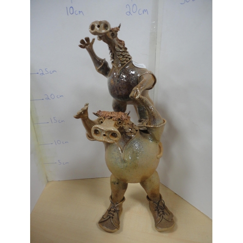 35 - Collection of contemporary figures and ornaments to include art pottery and humorous examples, and a... 