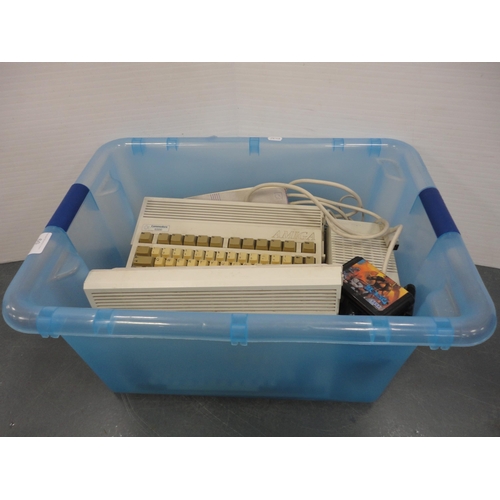 60 - Two Commodore Amiga A600 computers, mice, discs and accessories, also assorted Sega Megadrive games.
