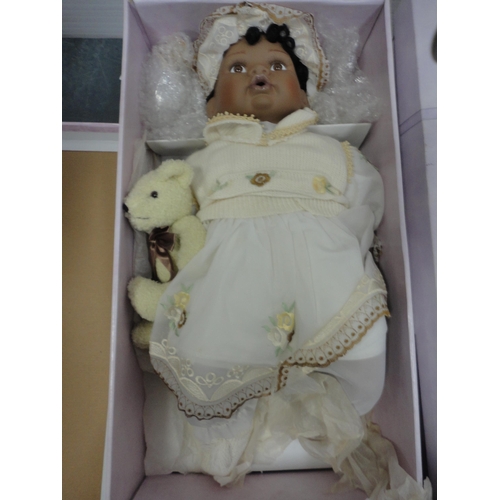 74 - Boxed Leonardo Collection porcelain dolls and teddy bears.