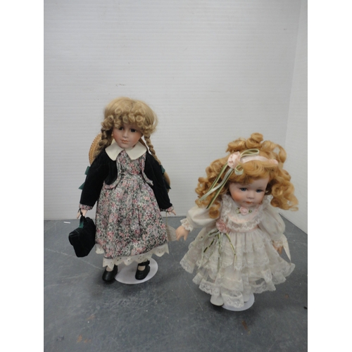 75 - Carton including Leonardo Collection porcelain-head dolls.
