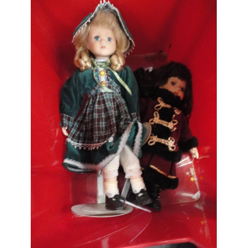 75 - Carton including Leonardo Collection porcelain-head dolls.