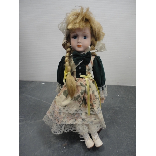 75 - Carton including Leonardo Collection porcelain-head dolls.
