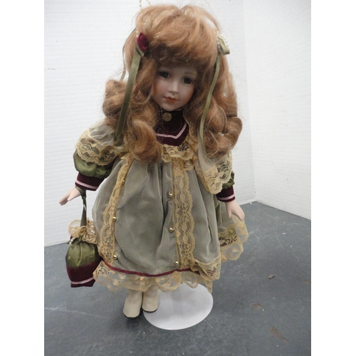75 - Carton including Leonardo Collection porcelain-head dolls.