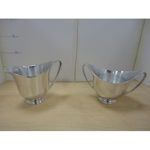 79 - Picquot four-piece tea set on tray.  (5)