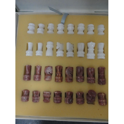82 - Two boxed chess sets.