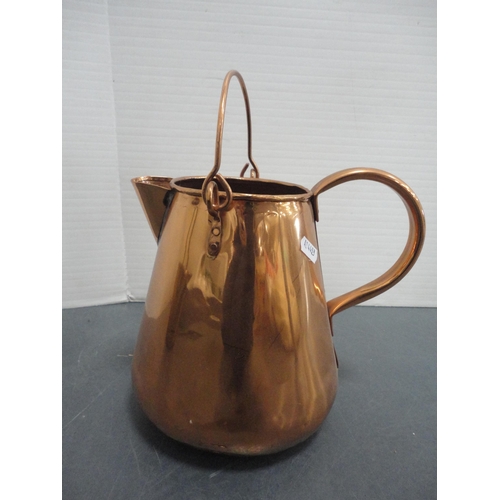 94 - Copper five litre jug, copper watering can and a brass jam pan with iron handle.  (3)