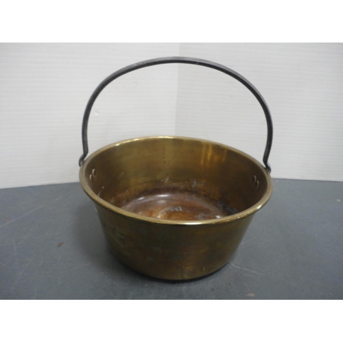94 - Copper five litre jug, copper watering can and a brass jam pan with iron handle.  (3)