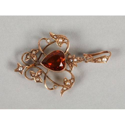 113 - 9kt gold Edwardian style pendant set with seed pearls and a central orange gem in the shape of a hea... 