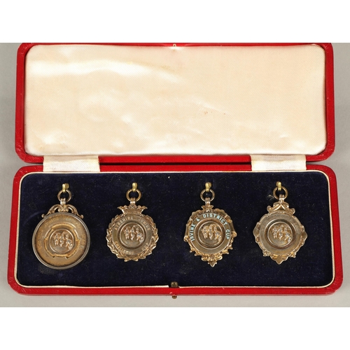 118 - Four hallmarked silver football medals awarded to J. McIntosh, Kilbirnie Ladeside FC, 1949-50 includ... 