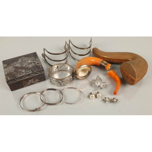 121 - Assorted items including silver bangles, vintage pipe in case (damaged), a white metal souvenir Clev... 