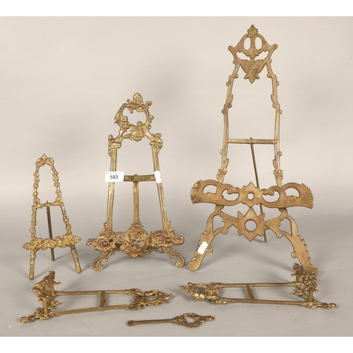 583 - Five ornate table top brass easels