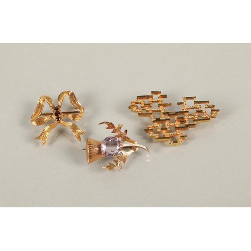 96 - Two 9ct gold brooches including a purple gem set thistle and a red gem set bow, and a mid century mo... 