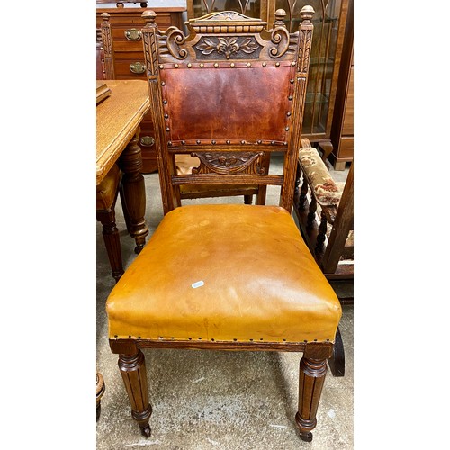 634 - Victorian oak telescopic dining table with additional leaf and a set of four carved oak dining chair... 