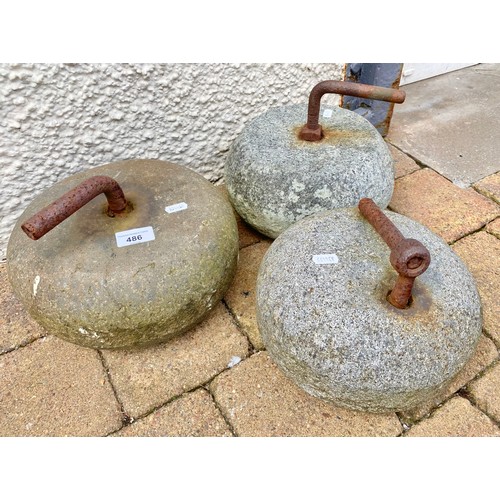 486 - Set of three curling stones with handles