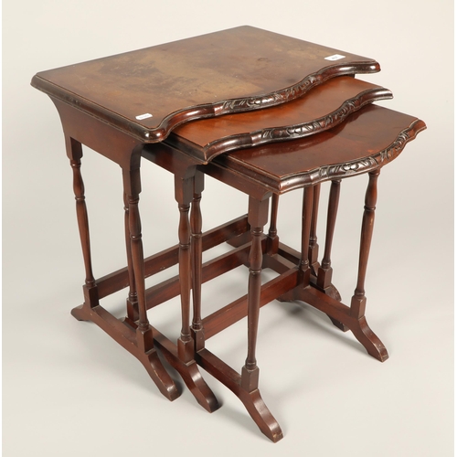 457 - Nest of three mahogany side tables