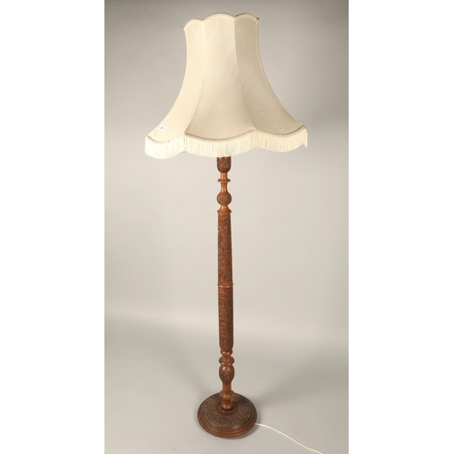 535 - Carved floor standing lamp & shade