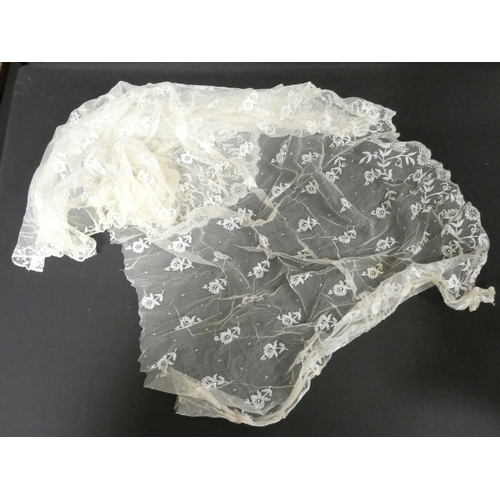 311 - Edwardian black net over jacket, a similar white lace floral decorated shawl, a black cape, various ... 