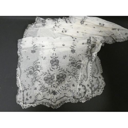 311 - Edwardian black net over jacket, a similar white lace floral decorated shawl, a black cape, various ... 