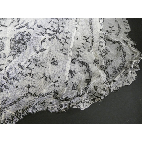 311 - Edwardian black net over jacket, a similar white lace floral decorated shawl, a black cape, various ... 