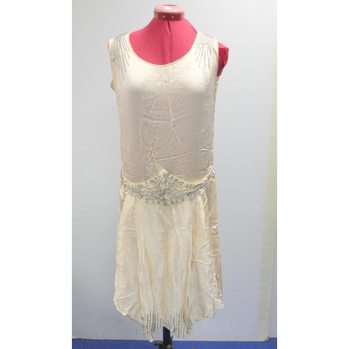 312 - A mid century flapper dress with beadwork accents also collection of various lace and other baby gow... 