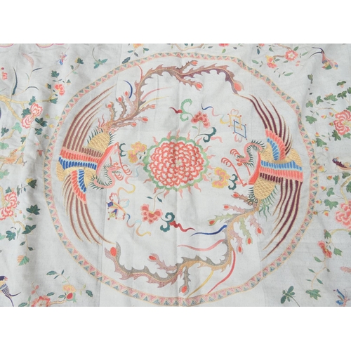 316 - Chinese silk embroidered bed cover with fringed border depicting two phoenix, exotic birds and flowe... 