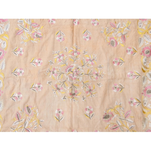 317 - Oriental pink ground table cover embroidered with flowers 120cm x 123cm.