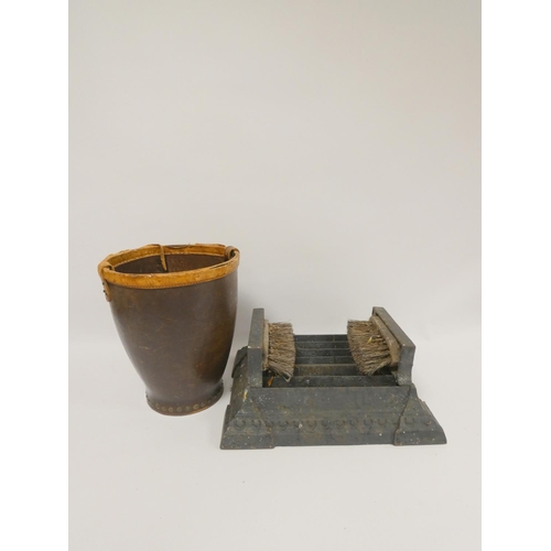 332 - Early 20th century cast iron boot cleaner and a leather fire bucket. (2)