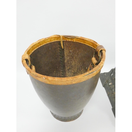 332 - Early 20th century cast iron boot cleaner and a leather fire bucket. (2)