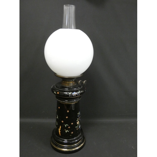 328 - Victorian duplex paraffin table light with opaque milk glass globe, the black glass base decorated w... 