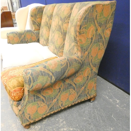 387 - Edwardian scroll arm oak frame sofa raised on turned supports in the manner of Liberty, upholstered ... 