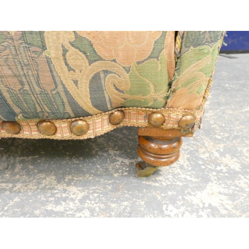 387 - Edwardian scroll arm oak frame sofa raised on turned supports in the manner of Liberty, upholstered ... 