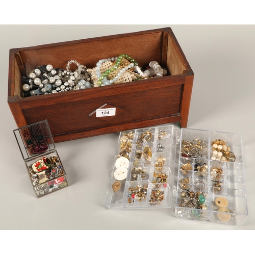 124 - Large quantity of costume jewellery in a lidded wooden box, including earrings, beads, necklaces, br... 