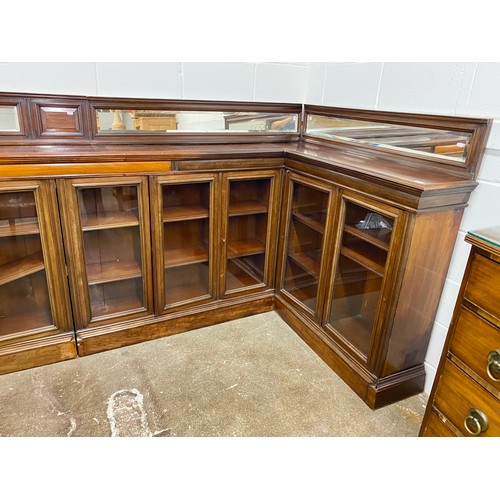 632 - Large L shaped corner bookcase unit, eight glazed doors, 130cm h including mirrored back, 32cm deep,... 