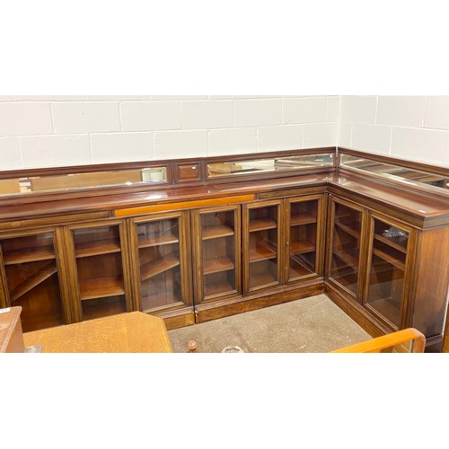 632 - Large L shaped corner bookcase unit, eight glazed doors, 130cm h including mirrored back, 32cm deep,... 