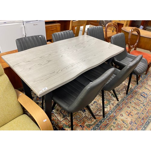 588 - Contemporary dining table with six matching chairs