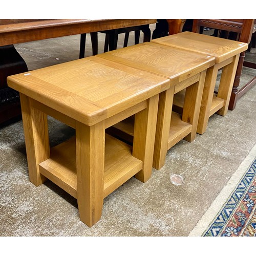 591 - Three oak two-tier side tables