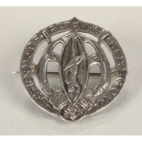 127 - Glasgow School of Art white metal badge, the pierced circular badge featuring the school of art coat... 