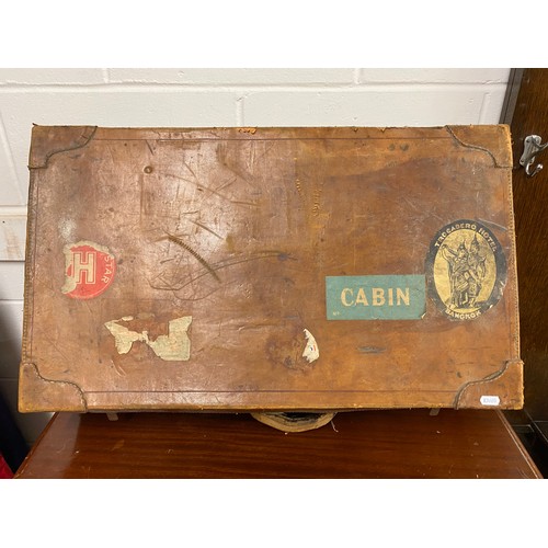 656 - Vintage leather travel trunk, stickers including Trocadero Hotel Bangkok, Ayr railway, etc.