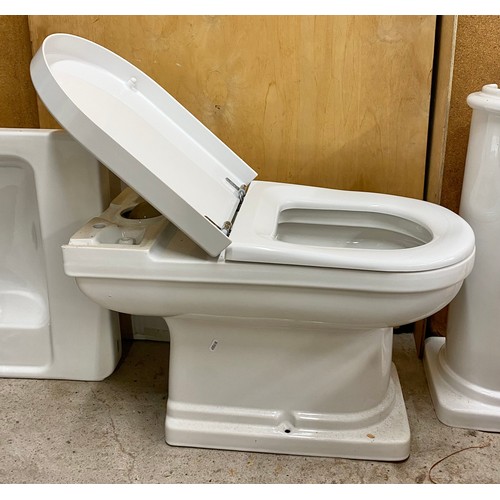 663 - White porcelain bathroom set including sink and toilet